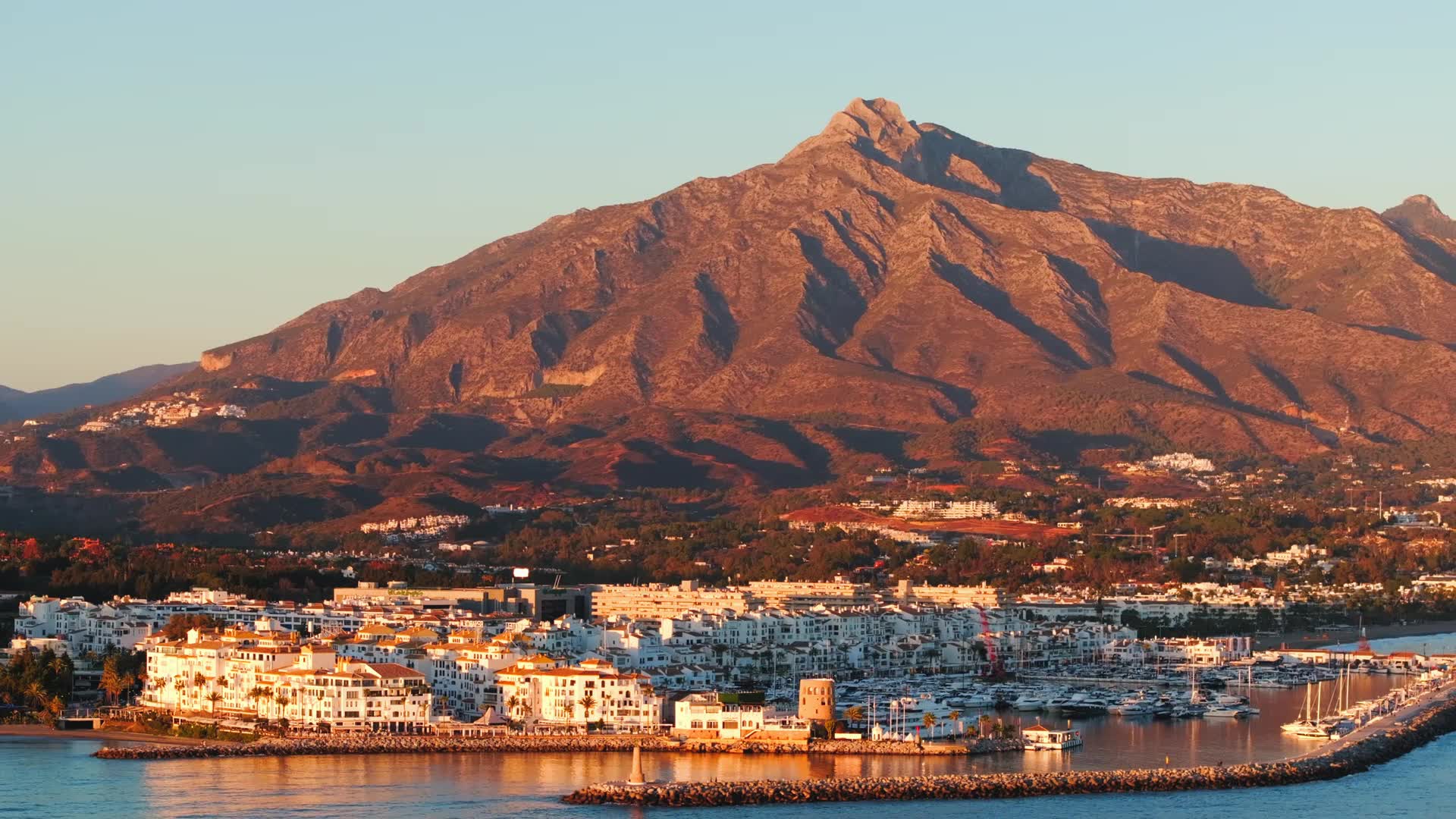 Marbella coastline at sunset with La Concha mountain and Puerto Banús